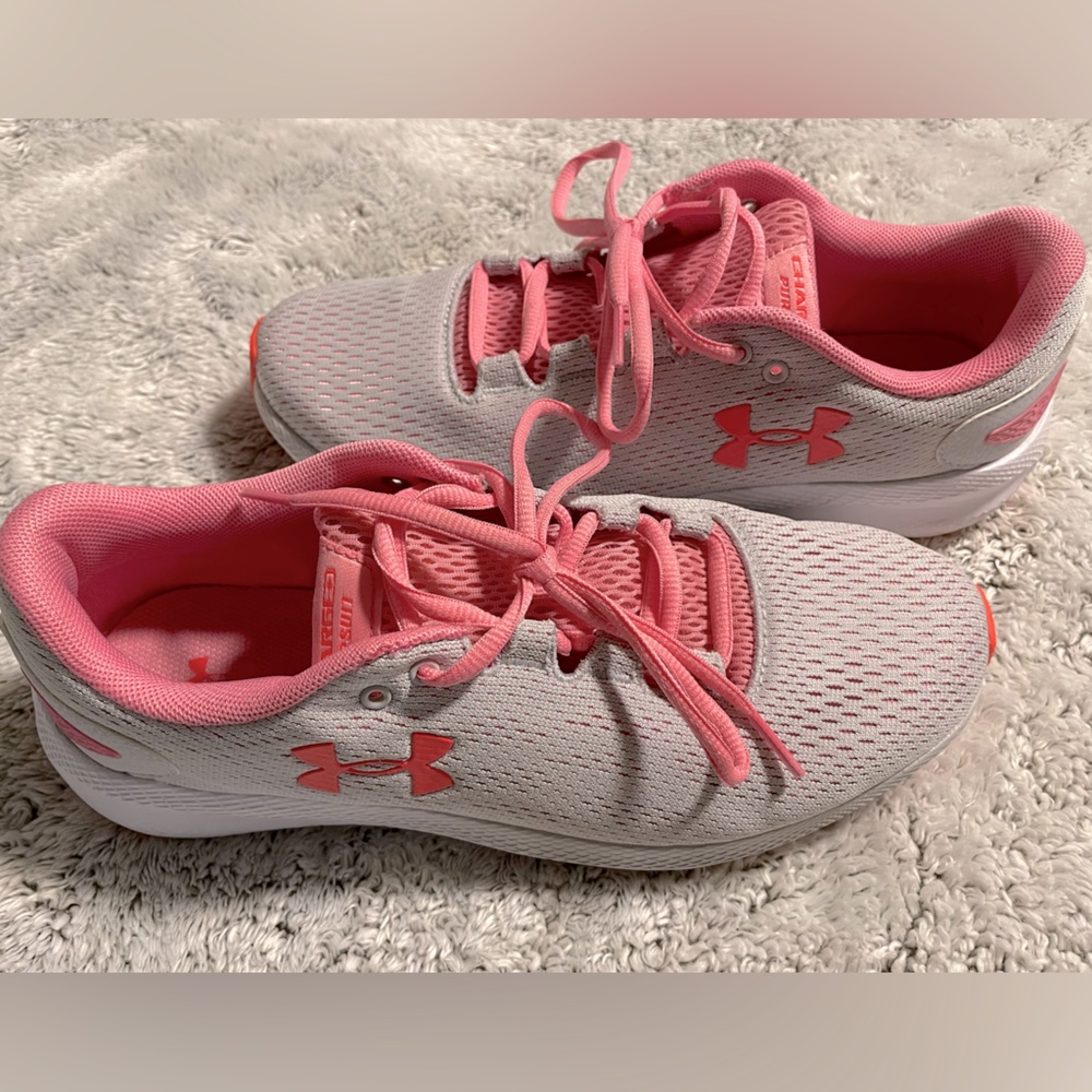 Under Armor running shoes. White with pink laces and trim. Size 8.5